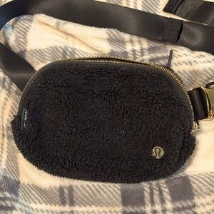 Gold and black crossbody lululemon fuzzy bag